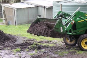 Green Team loader digging